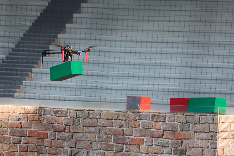 Drone carrying a brick